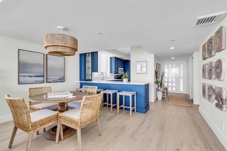 Bright open dining and kitchen area with coastal charm