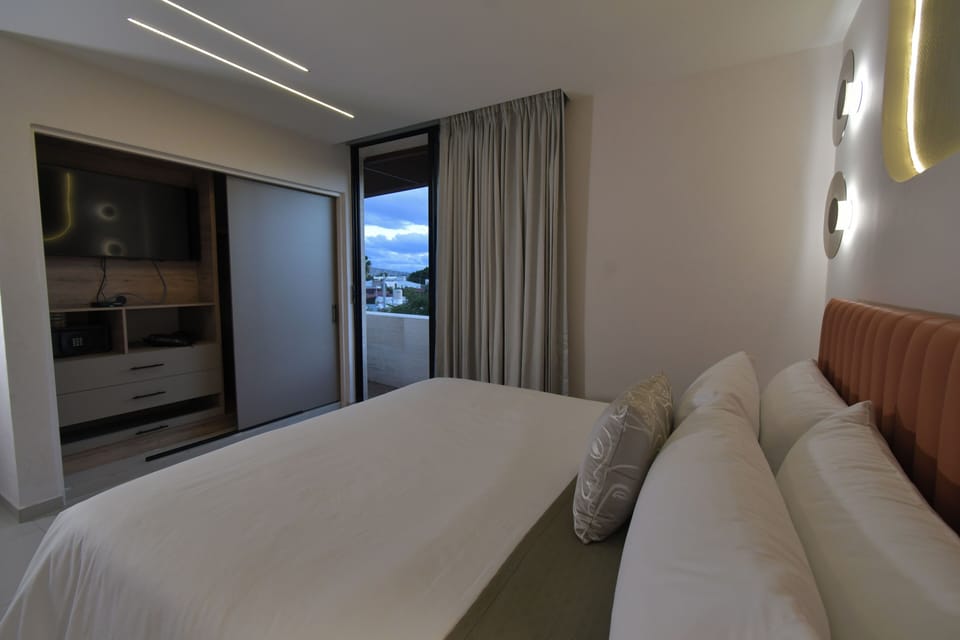Master Suite with balcony | In-room safe, desk, laptop workspace, blackout drapes