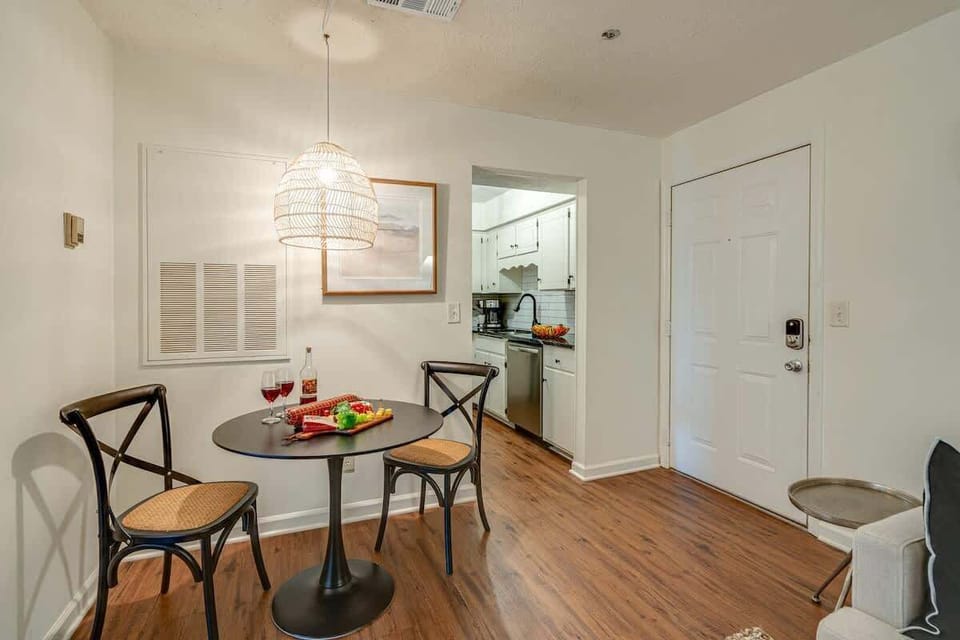 Stunning bohemian designed home with bright living space and designer furnishings. Features smart TV and connects to dining area and kitchen.