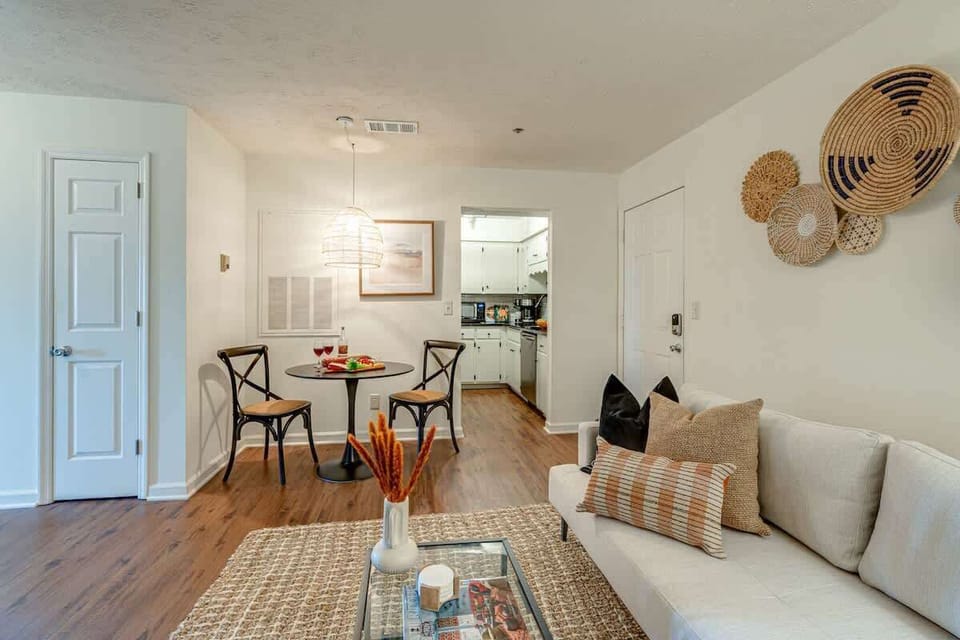 Stunning bohemian designed home with bright living space and designer furnishings. Features smart TV and connects to dining area and kitchen.
