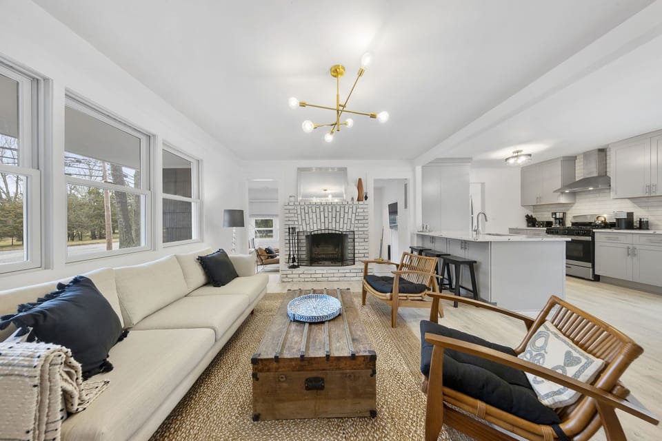 Living room open to the sunroom 
