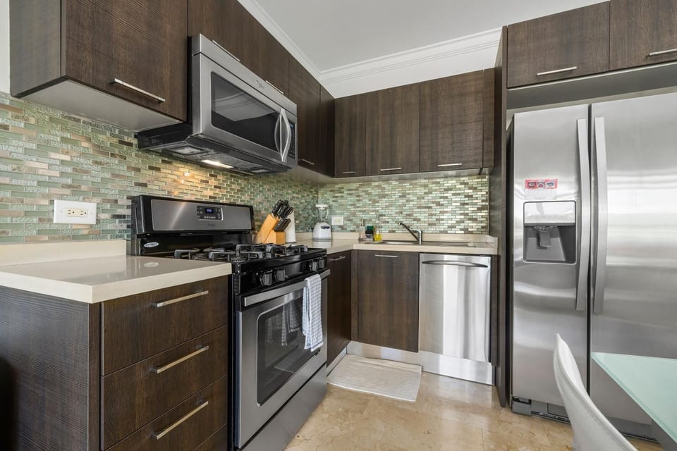 Well equipped kitchen with fridge