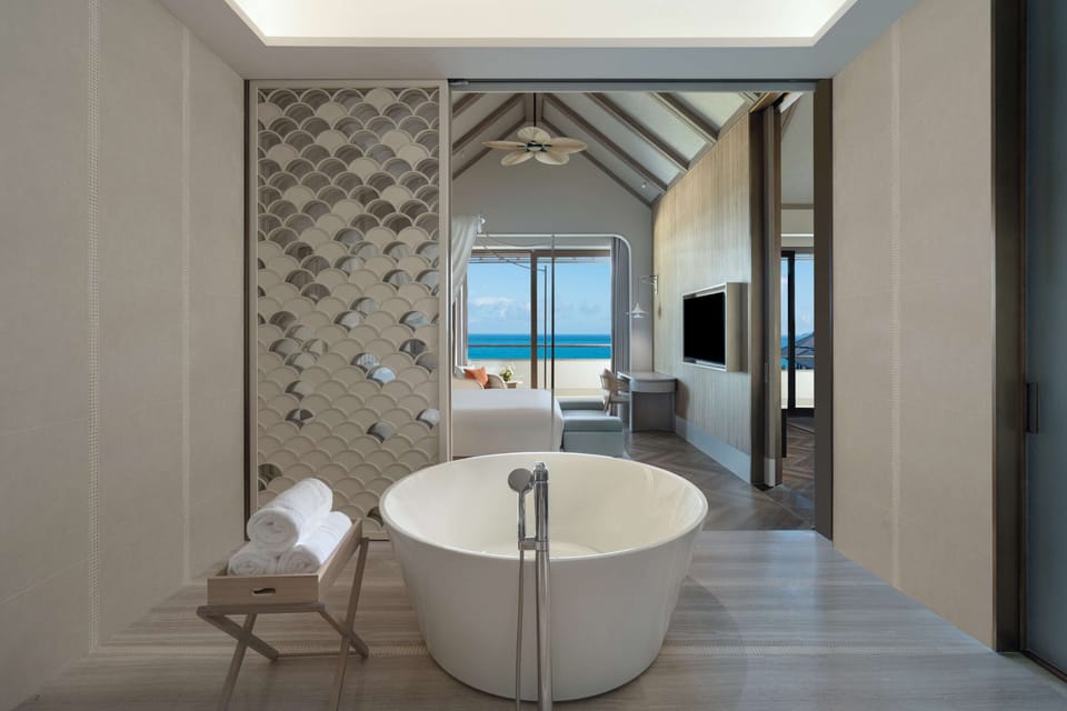 Combined shower/tub, rainfall showerhead, hair dryer, bathrobes