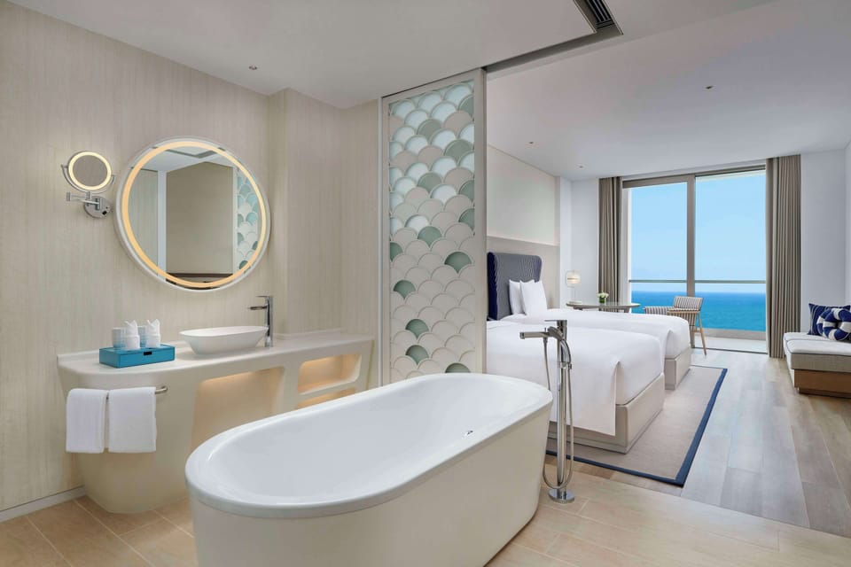 Combined shower/tub, rainfall showerhead, hair dryer, bathrobes