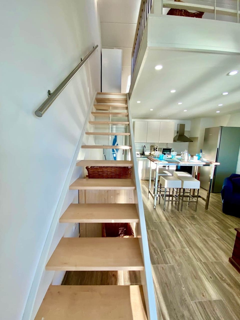 Stairway to the gallery with an open staircase