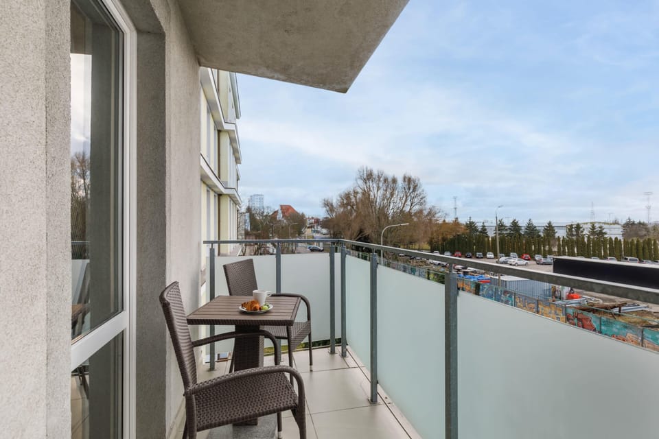 Balcony with garden furniture.