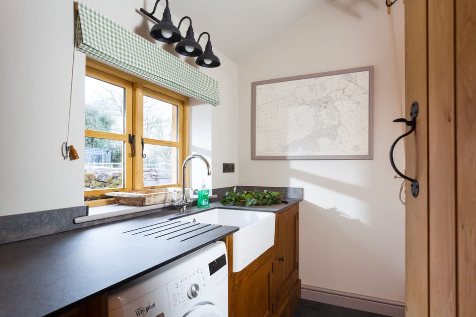 The utility room with washing machine
