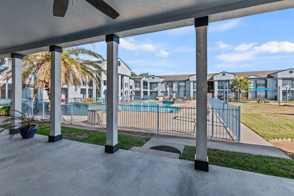 Elevated balcony area offering comfortable seating and pool-side atmosphere.