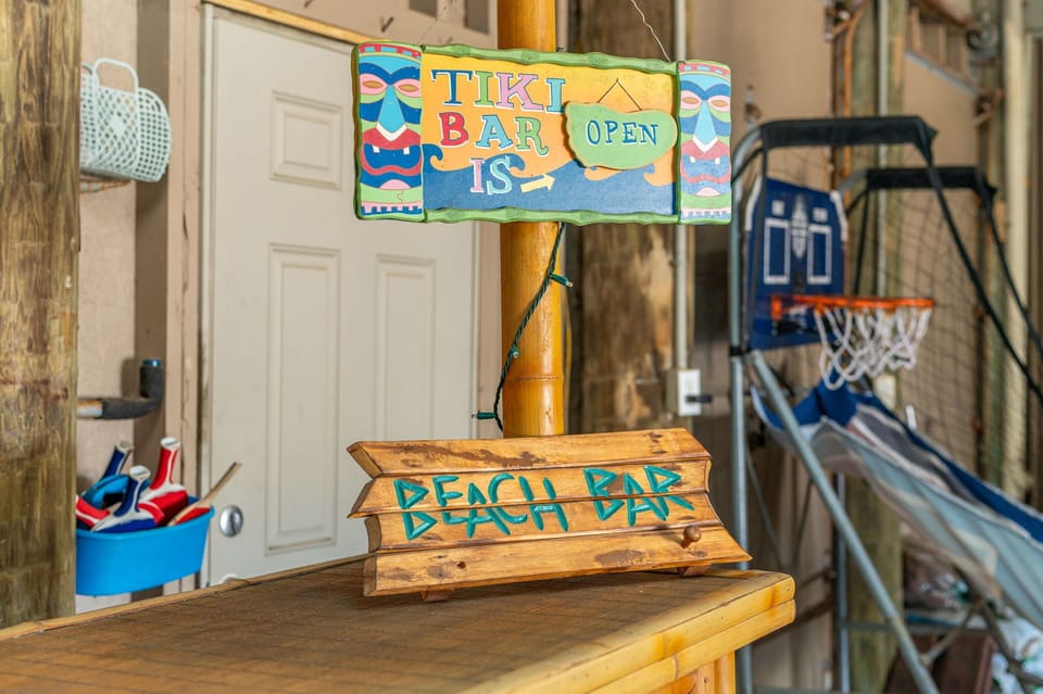 The game garage is where family memories are made—featuring a tiki bar, ping pong, pop-a-shot, and hammock swings for nonstop fun, friendly competition, and laughs for every age.