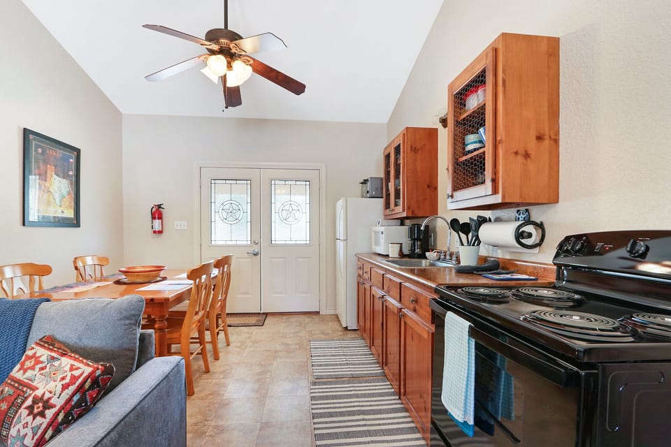 Just pass the lving room is the kitchen area with range and oven.