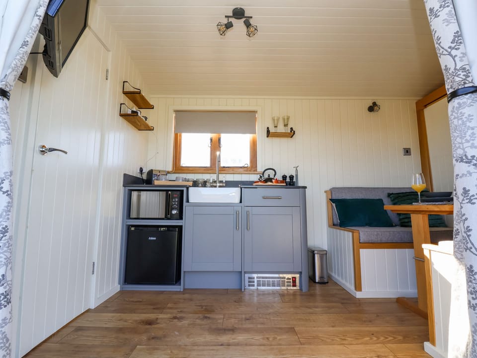 Fridge, electric kettle, toaster, cookware/dishes/utensils