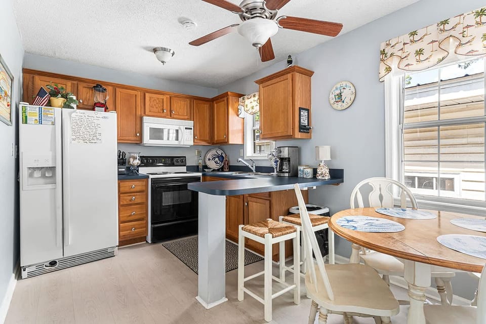 Bright kitchen with cozy breakfast nook and modern appliances