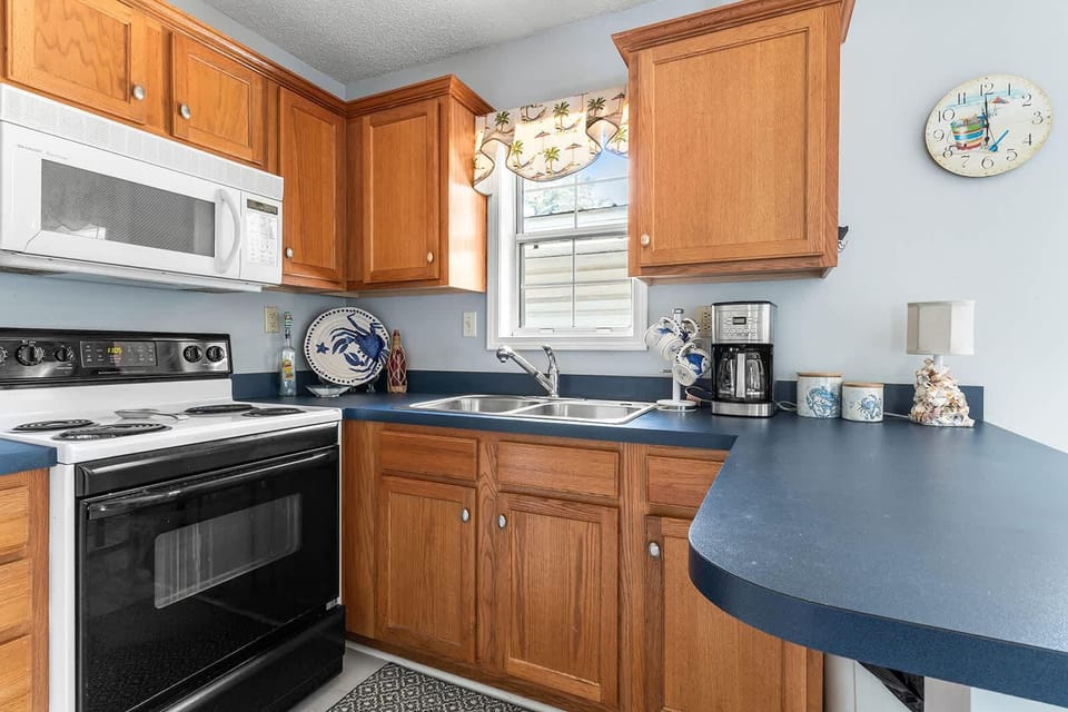 Cozy kitchen with warm wood cabinets and breakfast bar seating
