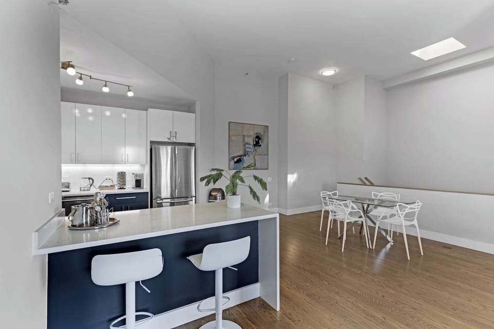 Aesthetic photo of dining area and breakfast island.