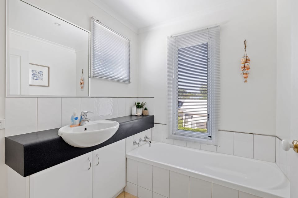 Main bathroom with bath and separate toilet. Located upstairs