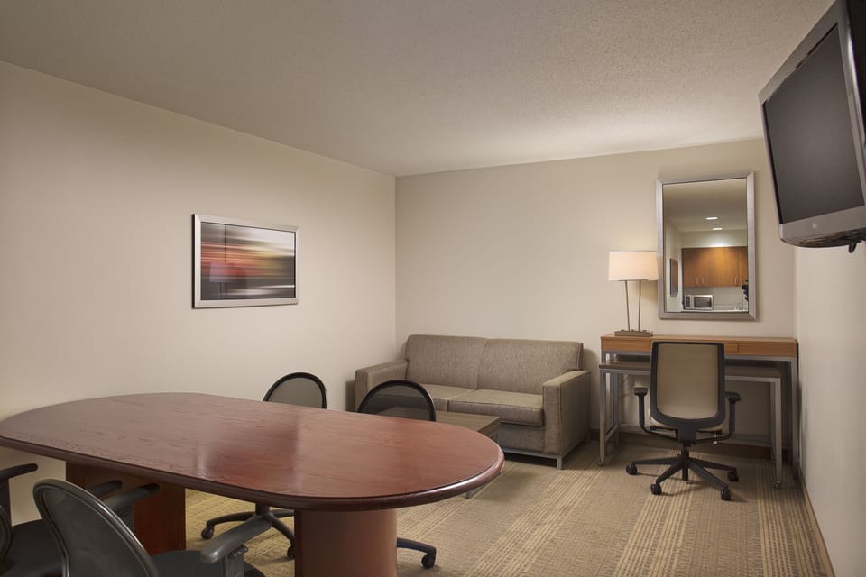 Suite, 1 King Bed, Roll-in Shower | Desk, blackout drapes, iron/ironing board, free cribs/infant beds