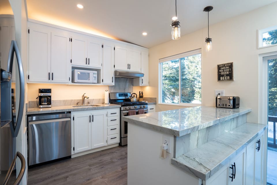 This recently remodeled kitchen is fully stocked with everything you need, from cookware to utensils, ensuring you're ready to prepare any meal with ease