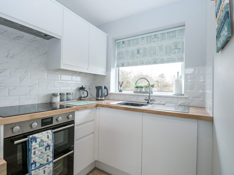 Fridge, electric kettle, toaster, cookware/dishes/utensils