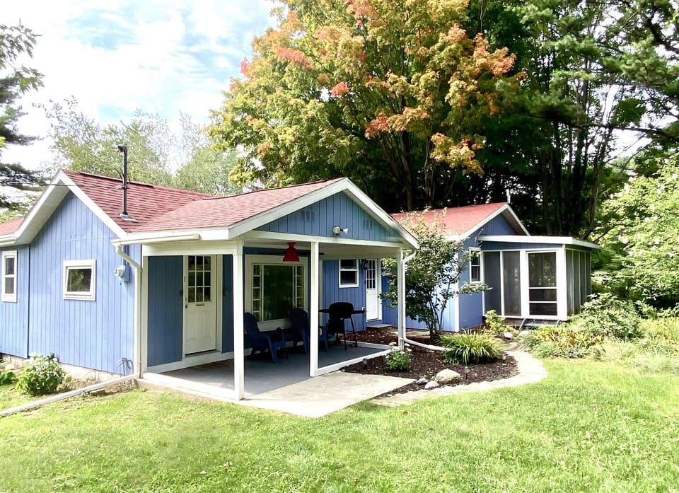 Back of Cottage - View of backyard and back of cottage showing covered patio and 3 season sunporch