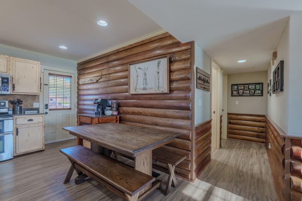 Kitchen table seats 6! Coffee bar with full pot and single cup brewing. Ground coffee and K-cups provided! This hallway leads to the downstairs bathroom and master bedroom.
