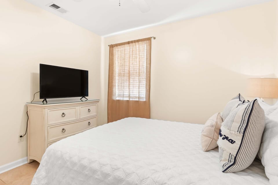 Bedroom 3 with a king-sized bed and flat screen TV