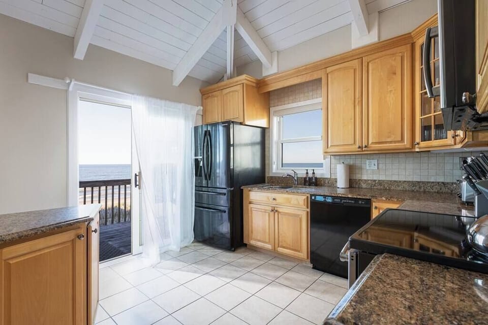 Fully Stocked Kitchen with bar seating for 4 and ocean views (w/ dishwasher, fridge, oven, microwave, toaster, drip & Krups coffee maker and more)