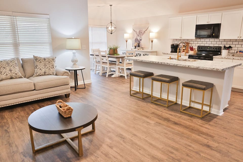 Stylish open concept between the living room, kitchen and dining areas