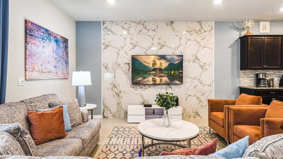 Elegant living area with marble accents and vibrant modern decor