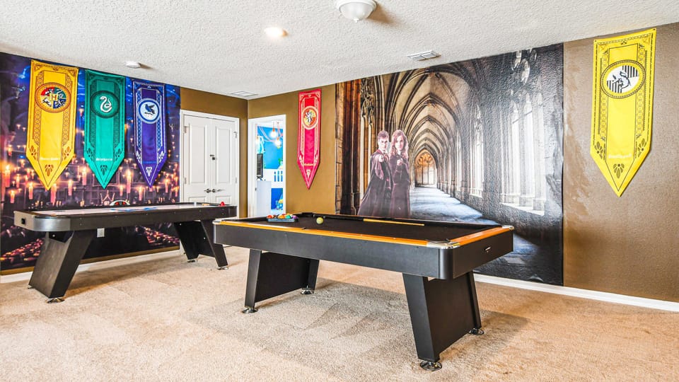 Magical game room with themed decor, pool, and air hockey fun