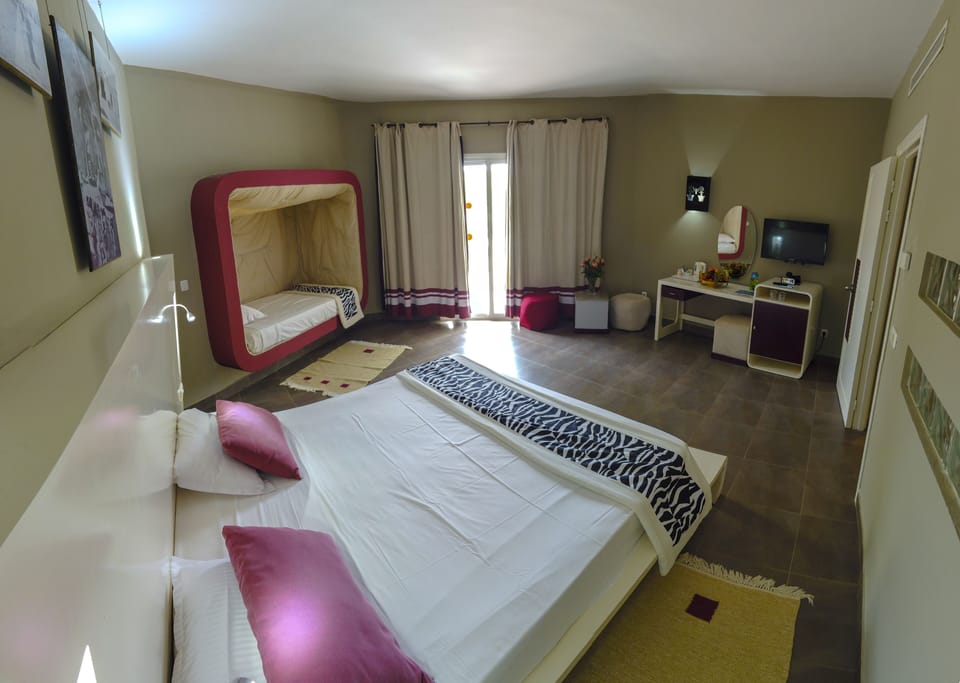 Family Room, Multiple Beds | 1 bedroom, free minibar, in-room safe, soundproofing