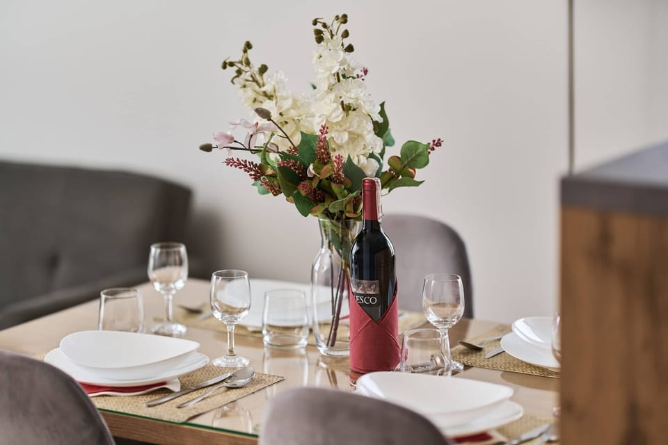 Dining table with tableware.