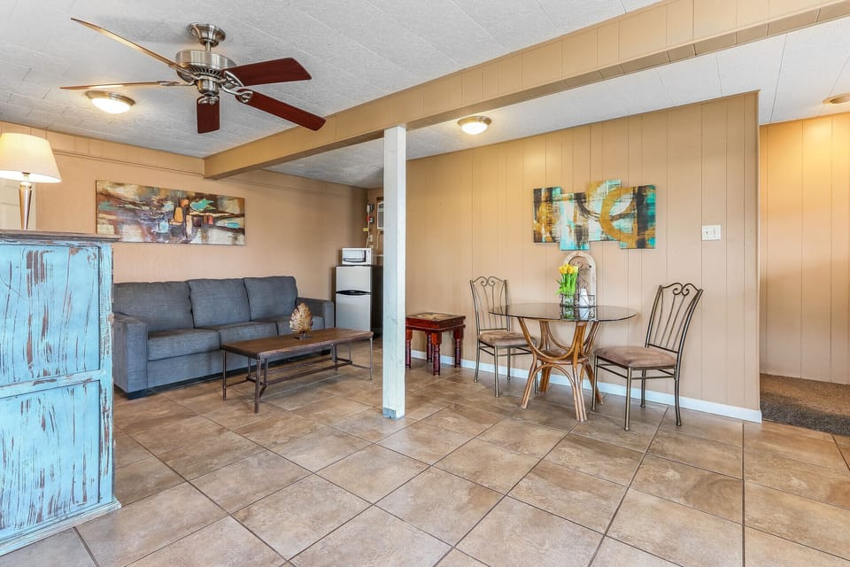 The lower level of the home features an open floor plan with seating and dining spaces.