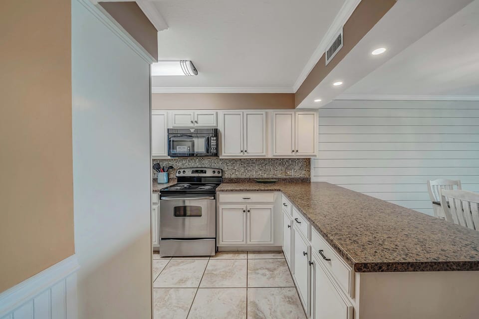 The fully equipped kitchen features stainless-steel appliances and has everything you need to prepare meals for family & friends.