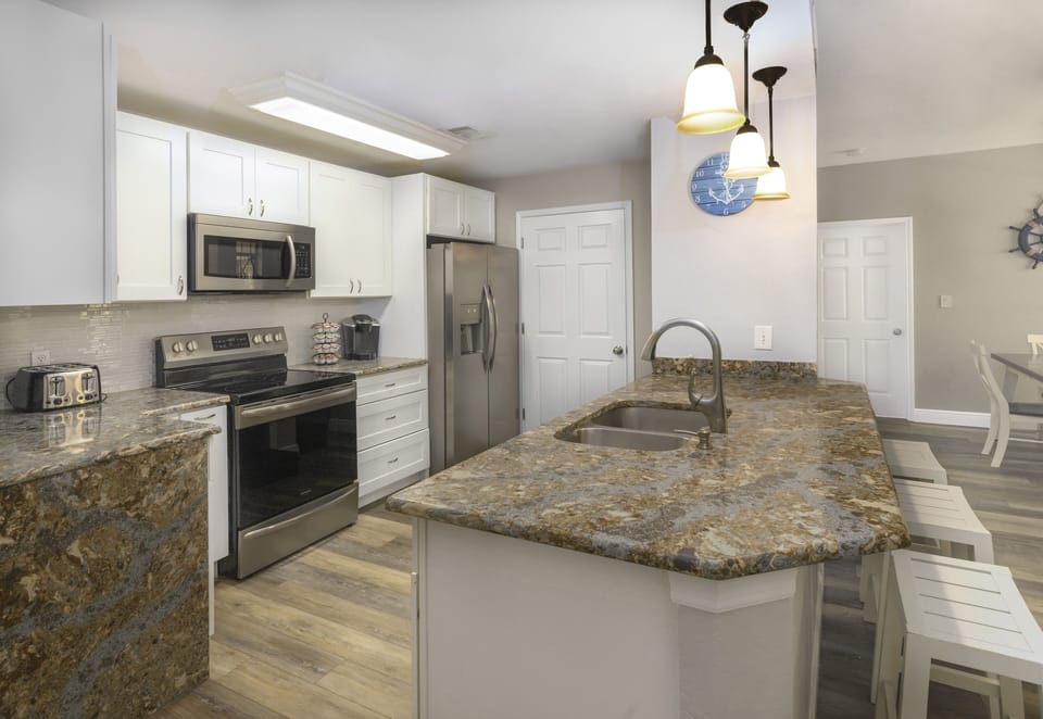 Custom Kitchen with Quartz Countertops and High-End Stainless-Steel Appliances.