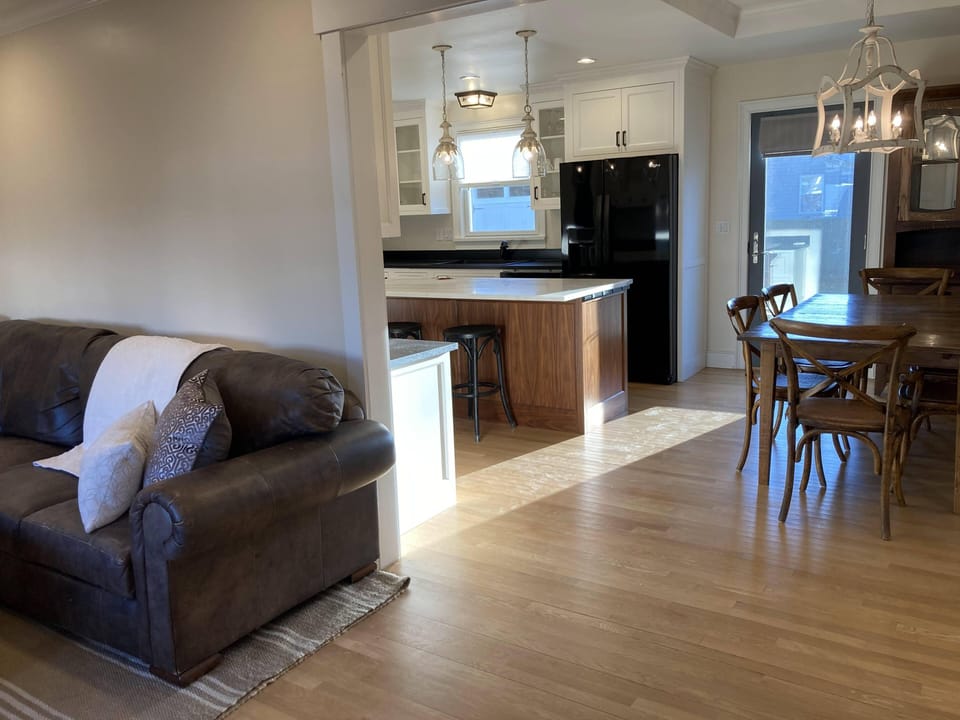 Living Room, Dining and Kitchen are all connected.