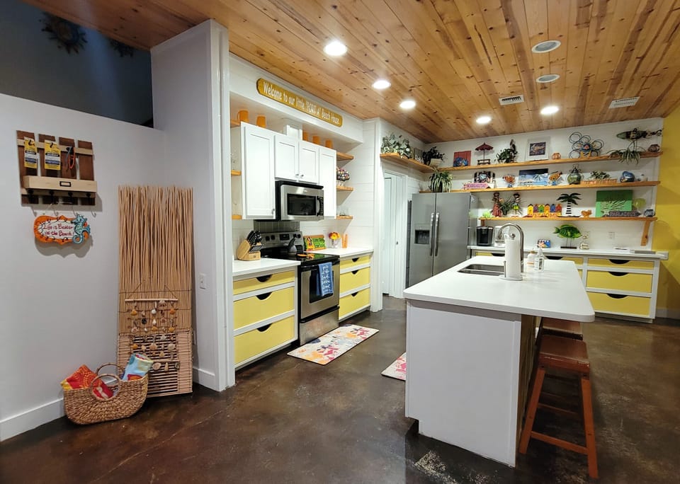 The full kitchen has a breakfast bar with additional seating