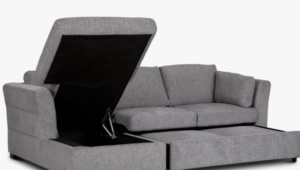 Couch transforms into queen bed and has bedding located inside of it. 