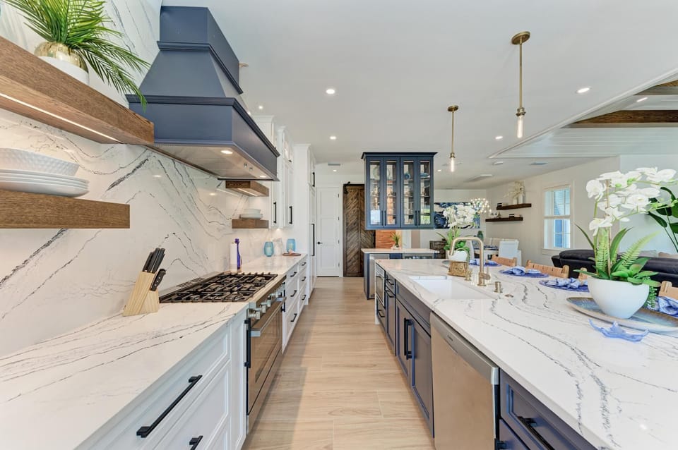 Custom chefs kitchen has copious amounts of cabinet and countertop space