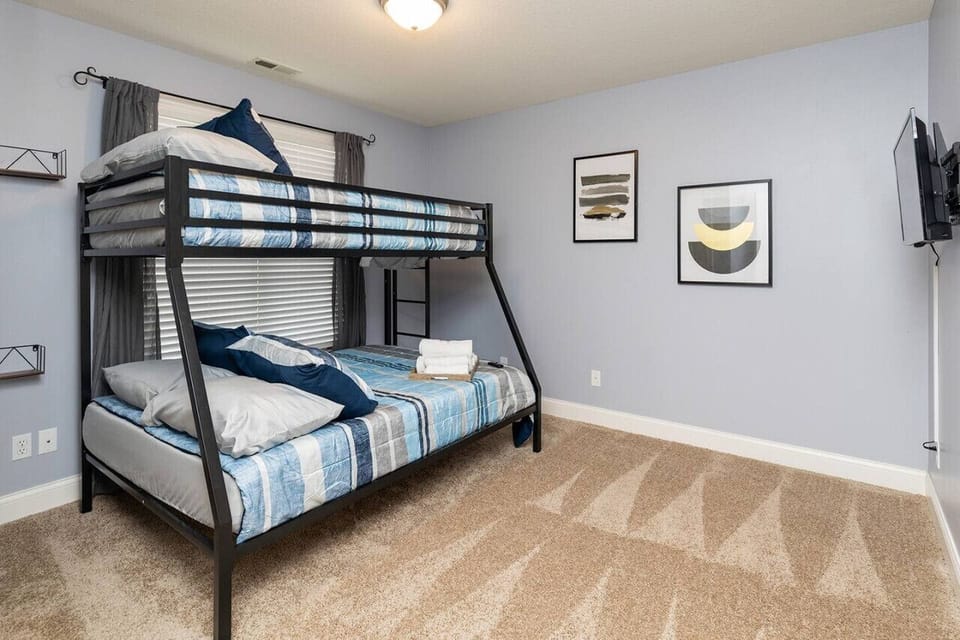 4th upstairs bedroom with Twin over Full bunk and smart TV