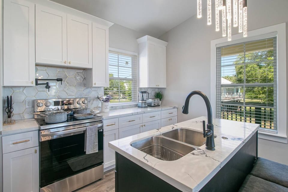 Unleash your inner chef in the fully equipped kitchen with flat-top stove, pot filler, dishwasher, and all cookware for delicious home-cooked meals