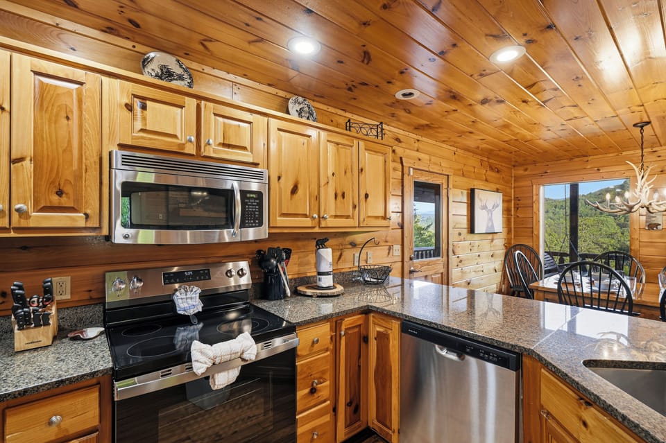 Kitchen with stainless appliances & bar seating for 4