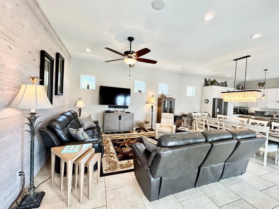Comfortable large living room with TV, where style meets relaxation.
