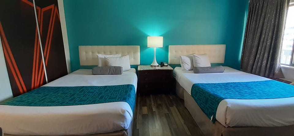 Room, 2 Queen Beds, Non Smoking | Desk, laptop workspace, blackout drapes, iron/ironing board