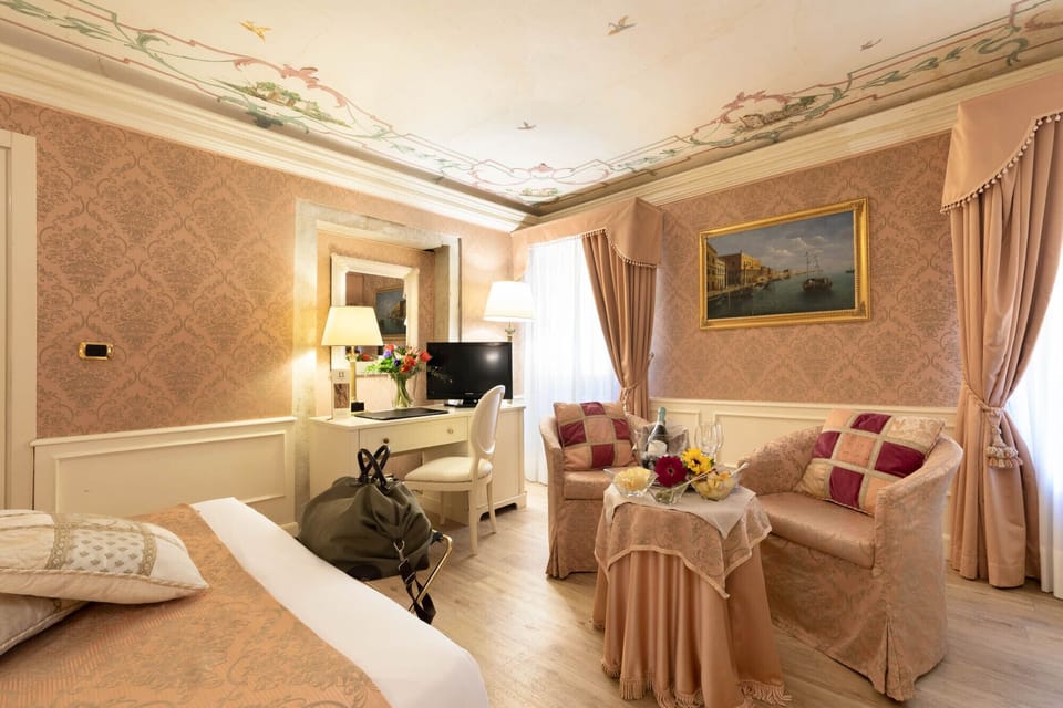 Deluxe Room, Canal View | Frette Italian sheets, premium bedding, down comforters, minibar