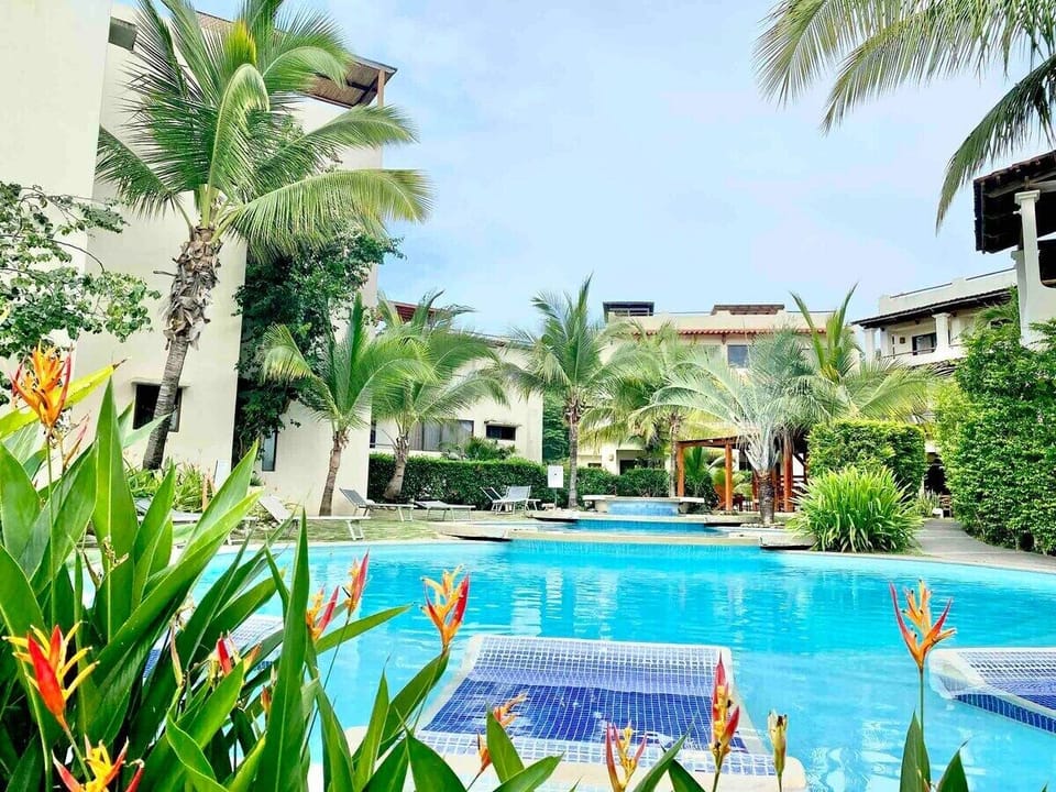 The back door of the condo leads out to this pool and rancho area