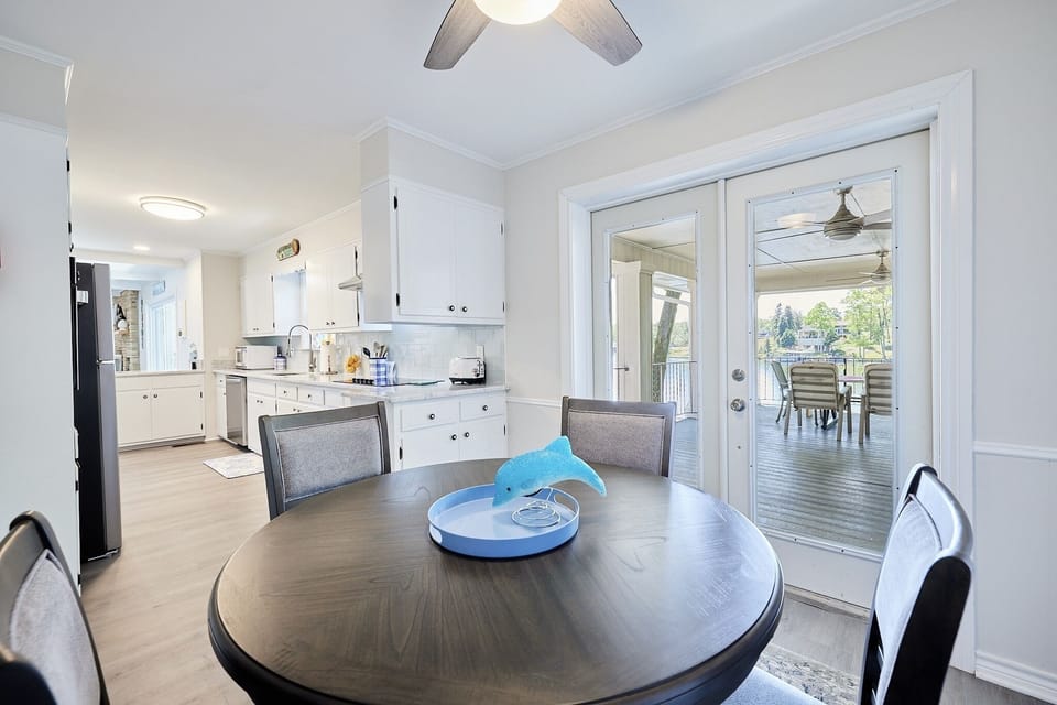 Breakfast area off of kitchen leading onto covered deck