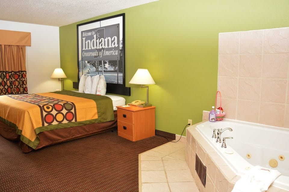 Desk, laptop workspace, blackout drapes, cribs/infant beds