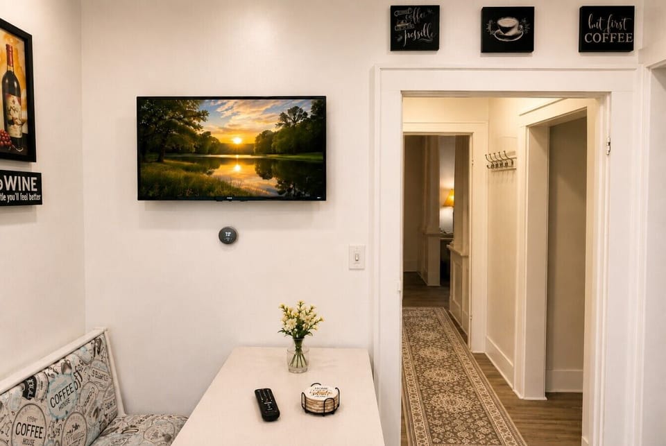Start the morning with coffee or a quick bite in this cozy breakfast nook, complete with a Smart TV for a relaxed start to the day.