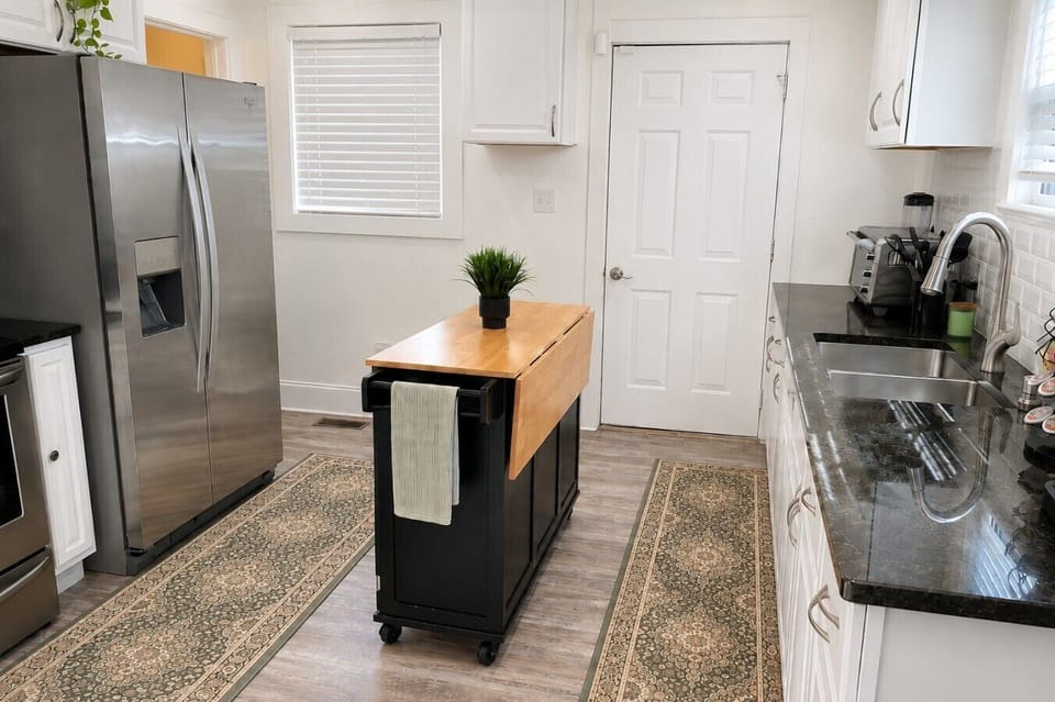 A bright, fully equipped kitchen with stainless steel appliances, generous counter space, and everything you need to prepare meals during your stay.
