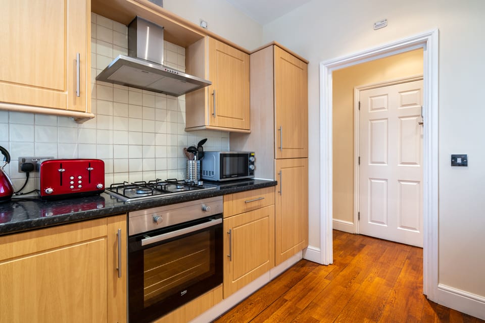 Deluxe Apartment | Private kitchen | Full-size fridge, microwave, oven, dishwasher